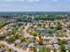 Aerial view of neighborhood featuring pond, mature trees, and single-Gathering homes at 4315 Oakland Dr, New Port Richey, FL 34653