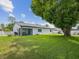A well-maintained backyard with a screened lanai and comfortable seating offers a relaxing outdoor space at 4315 Oakland Dr, New Port Richey, FL 34653