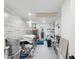 Spacious basement area with storage and laundry facilities, featuring clean, white walls and flooring at 4315 Oakland Dr, New Port Richey, FL 34653