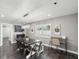 Inviting dining area featuring a black wooden table and chair set by a window with shutters at 4315 Oakland Dr, New Port Richey, FL 34653