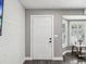 Bright foyer with a view into the living room and a white door at 4315 Oakland Dr, New Port Richey, FL 34653