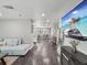 Open-concept living area showcases modern decor and seamless flow into dining area at 4315 Oakland Dr, New Port Richey, FL 34653