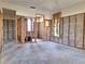 Spacious room with exposed walls and concrete floor, offering a blank canvas for renovation at 4328 Marine Pkwy, New Port Richey, FL 34652