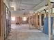 Exposed walls and a concrete floor, awaiting custom finishes to transform this spacious area at 4328 Marine Pkwy, New Port Richey, FL 34652