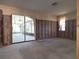 Unfinished living room showcasing sliders to the lanai and natural light from bright windows at 4328 Marine Pkwy, New Port Richey, FL 34652