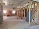 Spacious living room featuring exposed framing, bright windows, and ceiling fan at 4328 Marine Pkwy, New Port Richey, FL 34652