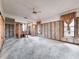 Spacious room with exposed walls and concrete floor, offering a blank canvas for renovation at 4328 Marine Pkwy, New Port Richey, FL 34652