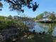 Picturesque waterfront property with boat dock, mature trees, and serene canal views at 4328 Marine Pkwy, New Port Richey, FL 34652