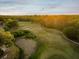 Aerial view of the golf course and trees at 4423 Gevalia Dr, Brooksville, FL 34604