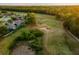 Aerial view of the golf course and trees at 4423 Gevalia Dr, Brooksville, FL 34604