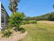Landscaped backyard view of golf course at 4423 Gevalia Dr, Brooksville, FL 34604