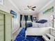 Bright bedroom features a large bed, and a window with dark drapes at 4423 Gevalia Dr, Brooksville, FL 34604