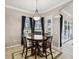 Cozy dining area with a round table, perfect for casual meals with a view of the pool area through large windows at 4423 Gevalia Dr, Brooksville, FL 34604