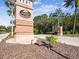 Landmark sign for Hernando Oaks surrounded by palm trees, brick columns and manicured landscaping at 4423 Gevalia Dr, Brooksville, FL 34604