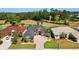 Well maintained single Gathering home boasts manicured lawn, mature landscaping, and golf course views at 4423 Gevalia Dr, Brooksville, FL 34604