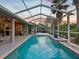 Relax by the pool and enjoy views of the backyard and golf course at 4423 Gevalia Dr, Brooksville, FL 34604