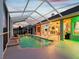 Inviting covered pool area with a tile patio and ample space for entertaining guests at 4423 Gevalia Dr, Brooksville, FL 34604