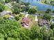 Home's beautiful lawn and brick driveway leads back to the home's backyard outdoor patio at 4469 Lake In The Woods Dr, Spring Hill, FL 34607