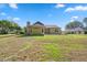 Large backyard featuring a well-maintained lawn perfect for outdoor activities and relaxation at 4469 Lake In The Woods Dr, Spring Hill, FL 34607