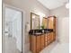 Bathroom with double sink vanity and ample storage at 4469 Lake In The Woods Dr, Spring Hill, FL 34607