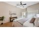 Bedroom featuring a ceiling fan, double door closet, neutral walls, and soft textures at 4469 Lake In The Woods Dr, Spring Hill, FL 34607