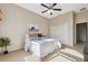Bedroom with ceiling fan, double door closet, neutral walls, and soft textures at 4469 Lake In The Woods Dr, Spring Hill, FL 34607