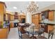 Gourmet kitchen featuring stainless steel appliances and stylish chandelier at 4469 Lake In The Woods Dr, Spring Hill, FL 34607