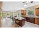 Spacious kitchen with a breakfast bar and seamless view to living room at 4469 Lake In The Woods Dr, Spring Hill, FL 34607