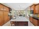 Spacious kitchen with a center island and connection to living and dining areas at 4469 Lake In The Woods Dr, Spring Hill, FL 34607