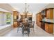 Gourmet kitchen and breakfast nook area, featuring granite countertops and wood cabinetry at 4469 Lake In The Woods Dr, Spring Hill, FL 34607