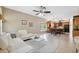 Open-concept living room and kitchen with modern finishes and plenty of space at 4469 Lake In The Woods Dr, Spring Hill, FL 34607