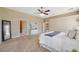 Spacious main bedroom featuring neutral colors, carpet, and a ceiling fan at 4469 Lake In The Woods Dr, Spring Hill, FL 34607