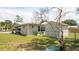 Well-maintained backyard with shed, chain link fence and a well-manicured lawn at 5031 Essex Ln, Spring Hill, FL 34606