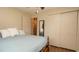 Comfortable bedroom with closet, a mirror and ceiling fan at 5031 Essex Ln, Spring Hill, FL 34606