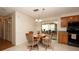 Bright dining area with a view of the Florida room, perfect for entertaining at 5031 Essex Ln, Spring Hill, FL 34606