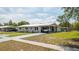 Beautiful single-story home with covered parking, landscaping, and concrete driveway at 5031 Essex Ln, Spring Hill, FL 34606