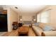 Comfortable living room featuring hardwood floors and ample natural light at 5031 Essex Ln, Spring Hill, FL 34606