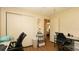 Comfortable home office with two desk spaces, closet, and views to main bedroom at 5031 Essex Ln, Spring Hill, FL 34606