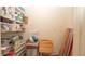 Walk-in pantry with shelving, laminate flooring, and storage at 5031 Essex Ln, Spring Hill, FL 34606