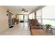 Spacious sunroom with tile flooring, lots of windows, and a comfortable seating area at 5031 Essex Ln, Spring Hill, FL 34606