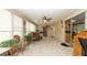 Large sunroom featuring tile floors, comfortable seating, and lots of plants for a relaxing space at 5031 Essex Ln, Spring Hill, FL 34606