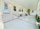 Spacious covered carport featuring painted concrete and white brick style decor around the base at 585 Sky Harbor Dr # 219, Clearwater, FL 33759