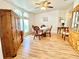 Bright dining area with hardwood flooring and light streaming through large windows at 585 Sky Harbor Dr # 219, Clearwater, FL 33759