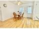 Cozy dining area featuring a round glass table and light hardwood floors at 585 Sky Harbor Dr # 219, Clearwater, FL 33759