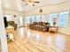 Bright living room with hardwood floors, vaulted ceiling, and many windows at 585 Sky Harbor Dr # 219, Clearwater, FL 33759