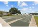 Several shuffleboard courts are situated with a waterfront view in the background at 585 Sky Harbor Dr # 219, Clearwater, FL 33759