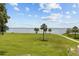 Waterfront with green space and palm trees at 585 Sky Harbor Dr # 219, Clearwater, FL 33759