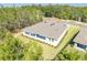 An attractive home with lawn and landscaping is seen from an aerial perspective at 6063 Dusk Rose Ln, Brooksville, FL 34601