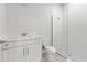 Bathroom with a stand-up shower, white subway tile, and a white vanity at 6063 Dusk Rose Ln, Brooksville, FL 34601