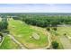 A captivating aerial view of the golf course, showcasing the manicured greens and tree-lined fairways at 6063 Dusk Rose Ln, Brooksville, FL 34601